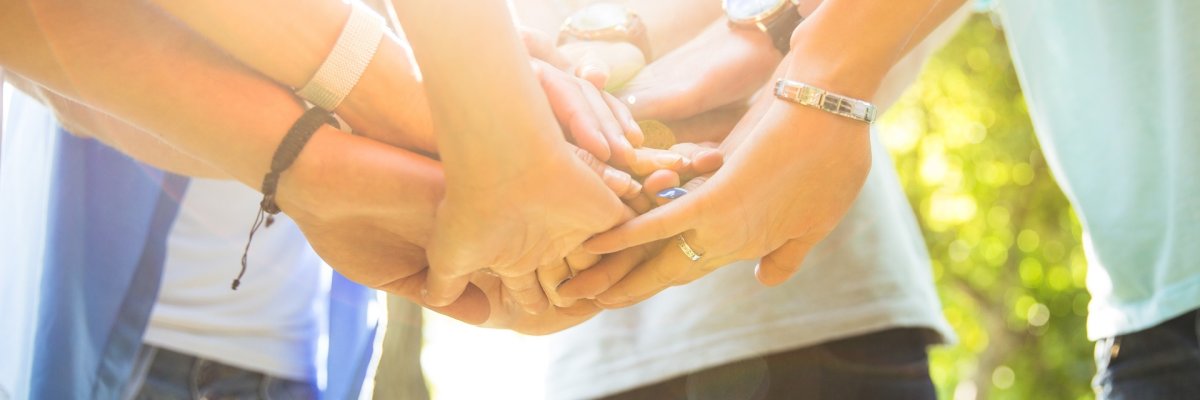 Students hands together Students hands together