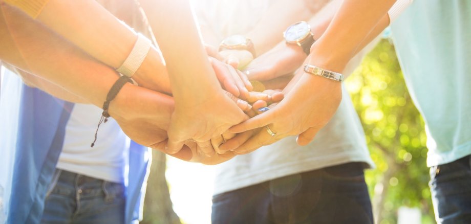 Students hands together