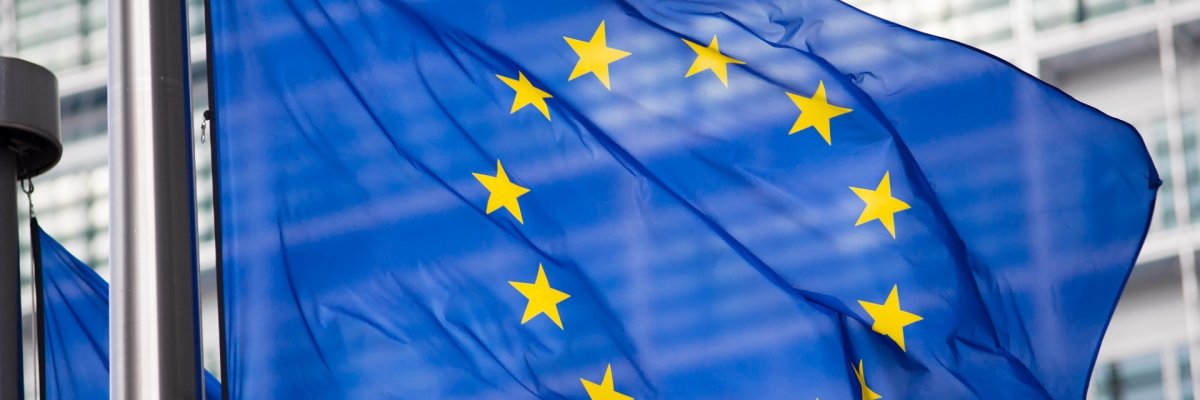 EU flag in front of Berlaymont building facade