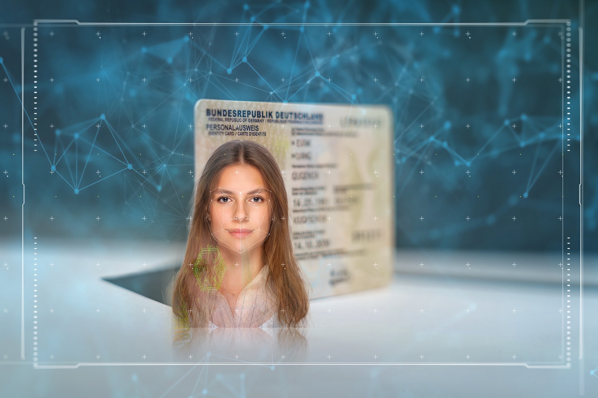 Ein Symbolfoto auf dem ein Personalausweis und ein biometrisches Foto zu sehen sind.